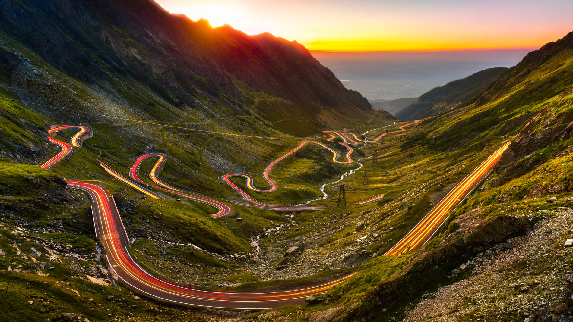 Traffic trails on Transfagarasan pass at sunset. Crossing Carpathian mountains in Romania, Transfagarasan is one of the most spectacular mountain roads in the world.
