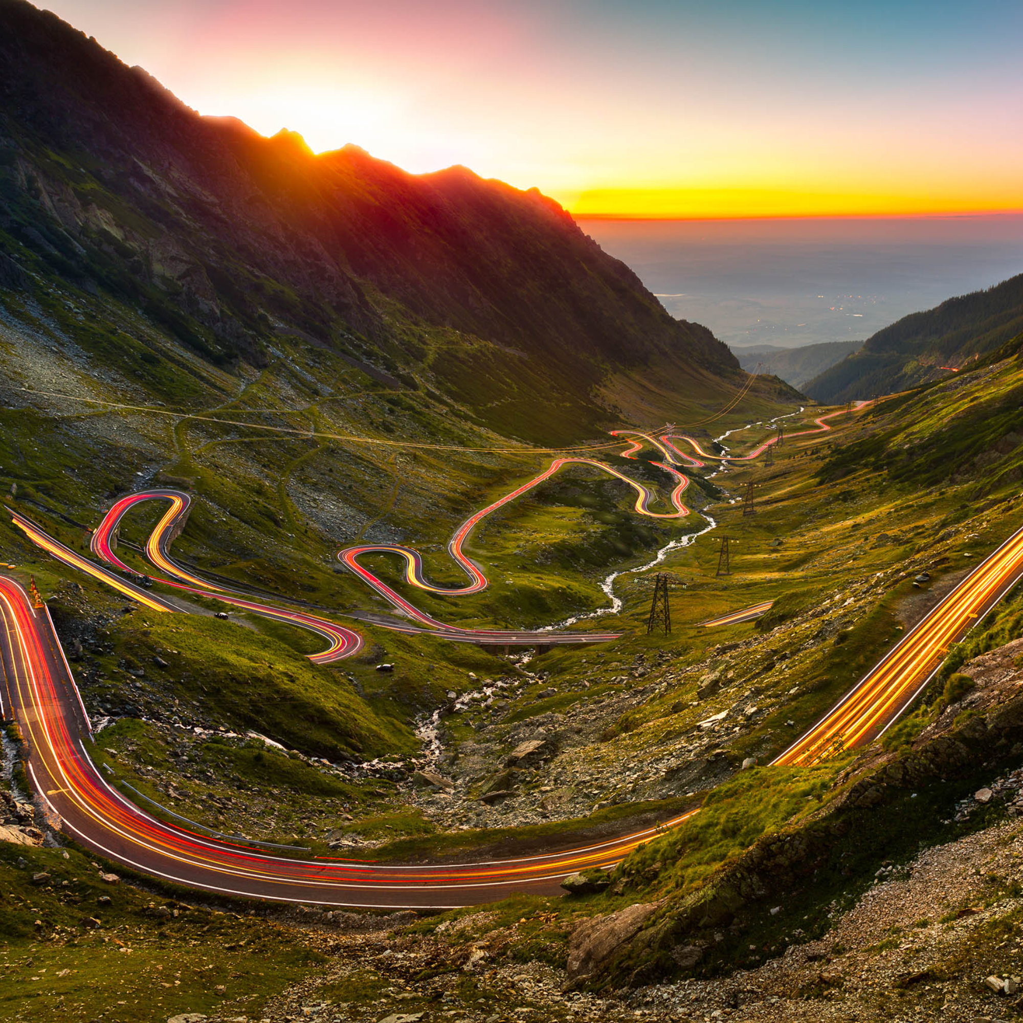 Traffic trails on Transfagarasan pass at sunset. Crossing Carpathian mountains in Romania, Transfagarasan is one of the most spectacular mountain roads in the world.