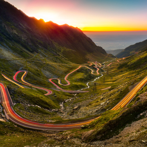 Traffic trails on Transfagarasan pass at sunset. Crossing Carpathian mountains in Romania, Transfagarasan is one of the most spectacular mountain roads in the world.